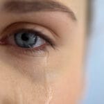 Sad woman crying, suffering pain eyes full of tears, domestic violence victim